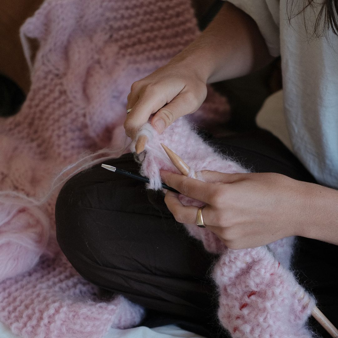 hands knitting cables